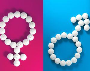 Tabletten, aus denen das Frauen- und das Männerzeichen gelegt sind.